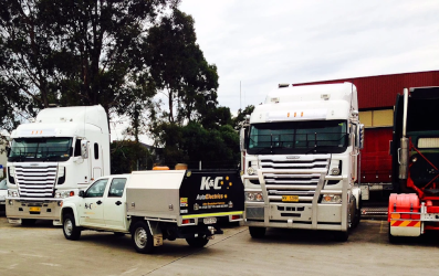 A mobile unit and two K&C trucks being serviced